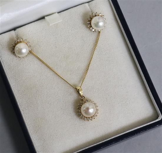 A 9ct gold, cultured pearl and diamond set pendant on chain and pair of matching ear studs.